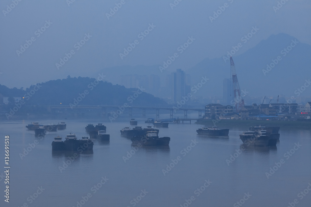 a ship in ou river, haze, fog, bad air condition