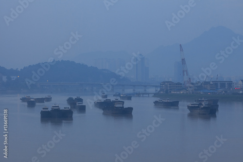 a ship in ou river, haze, fog, bad air condition © gornostaj
