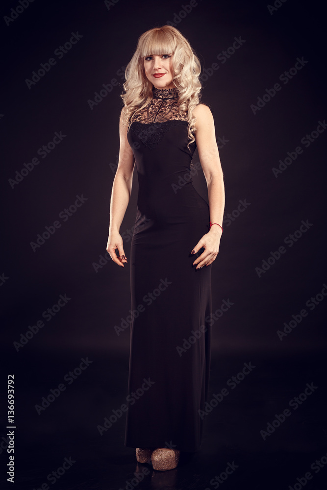 Elegant fashion photo of glamor beautiful blonde-haired woman in sexy dress with gold jewelry and posing in the studio,luxury Elegant fashion photo of glamor beautiful blonde-haired woman in sexy dress with gold jewelry and posing in the studio,luxury
