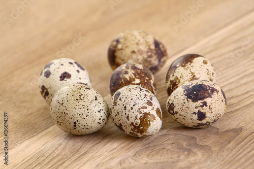 Quail eggs on a wood table