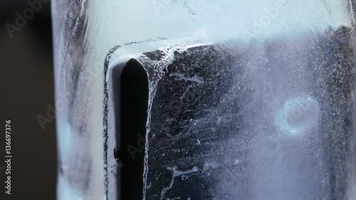Smartphone is frozen in ice