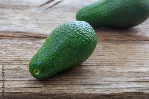 Avocados on a wooden background