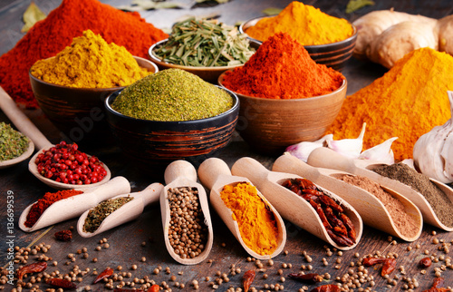 Fototapeta Naklejka Na Ścianę i Meble -  Variety of spices and herbs on kitchen table
