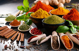 Variety of spices and herbs on kitchen table