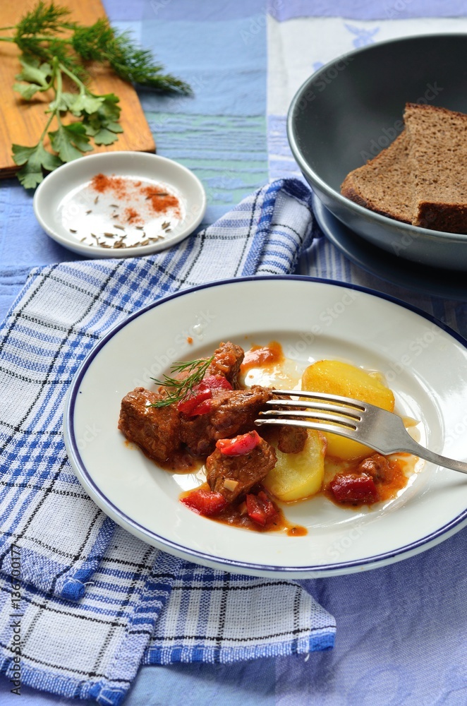 Beef goulash with sauce and potatoes Beef goulash with sauce and potatoes