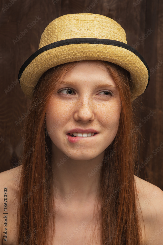Red-haired girl with red hat Red-haired girl with red hat