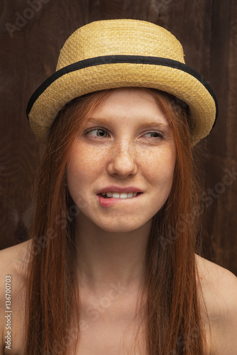 Red-haired girl with red hat