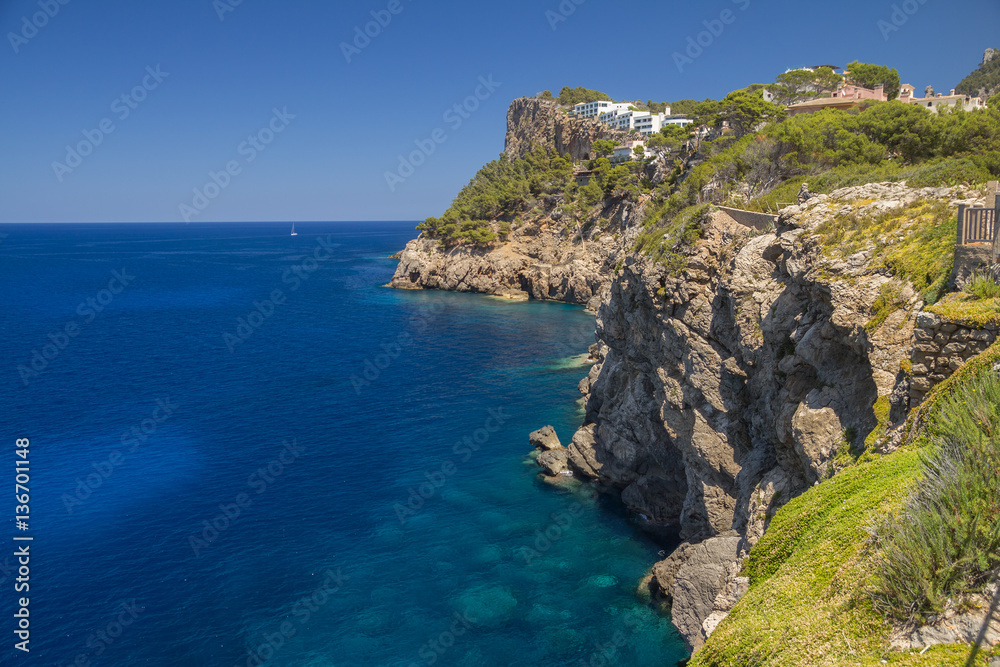 cliffs coastline with calm deep blue sea