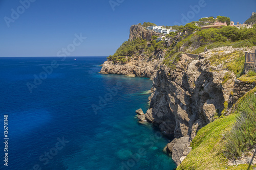 cliffs coastline with calm deep blue sea