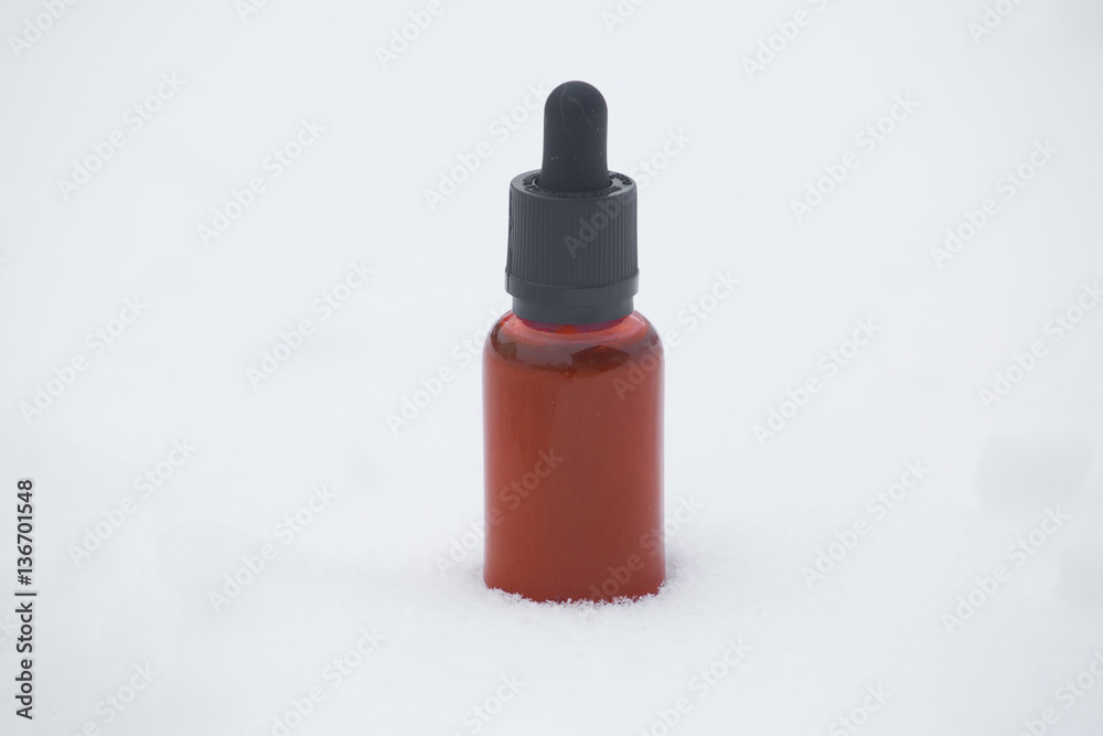 vape red bottle with liquid for electronic cigarette in snow vape red bottle with liquid for electronic cigarette in snow