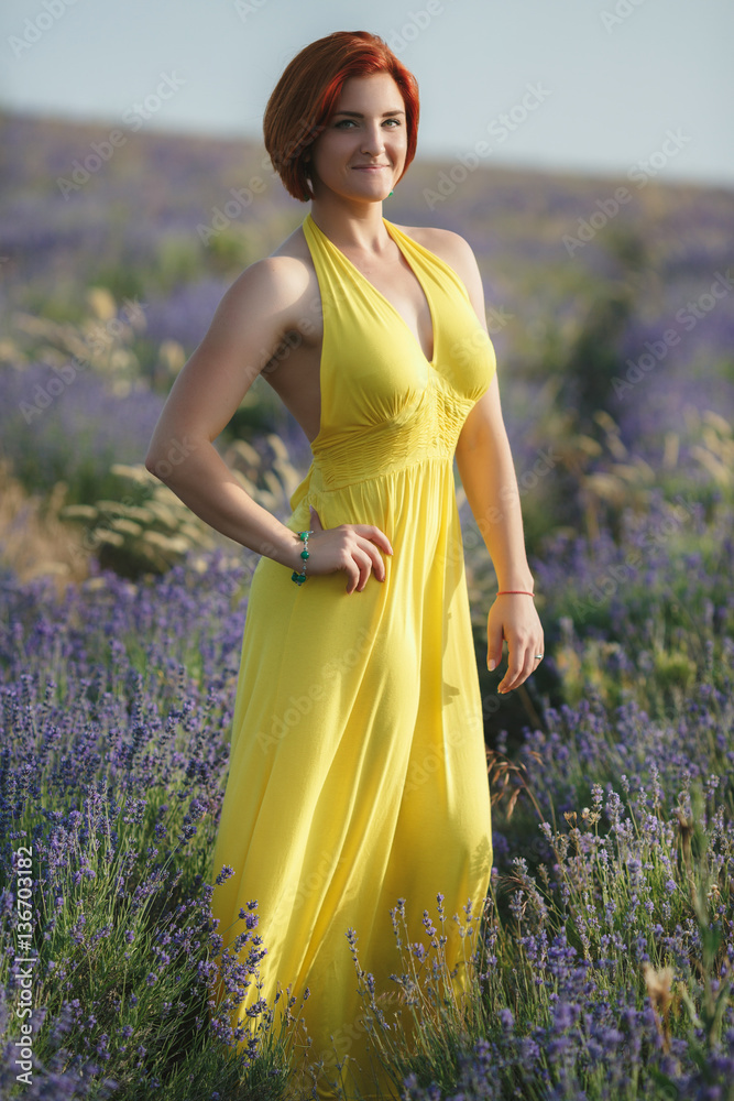 smiling beautiful brunette in the lavender field at sunset smiling beautiful brunette in the lavender field at sunset