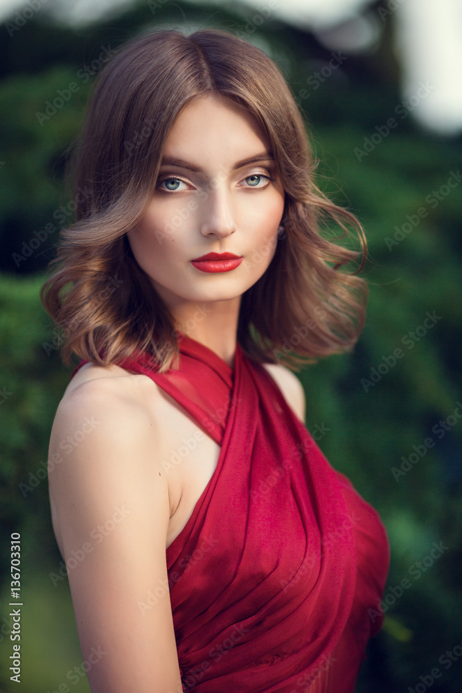 Fashionable hair disheveled braid around the head .Happy beautiful young model girl in summer blossom park. Fashionable hair disheveled braid around the head .Happy beautiful young model girl in summer blossom park.
