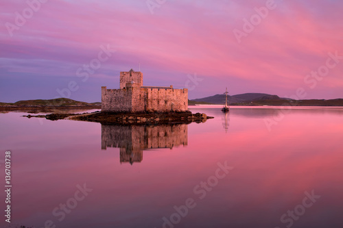 Kisimul Castle on Barra in the Outer Hebrides of Scotland is a formidable fortress founded in 1039 and situated on an islet facing the village of Castlebay. 