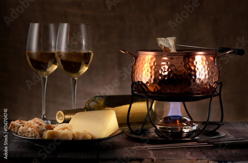 cheese fondue on rustic background