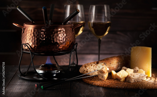 Swiss fondue cheese on rustic background