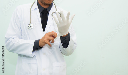 Doctor is wearing medical glove