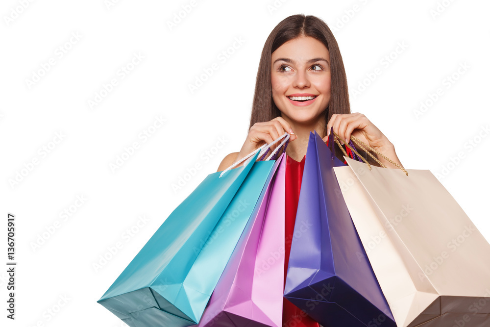 Smile beautiful happy woman holding shopping bags, sale, isolated on white background Smile beautiful happy woman holding shopping bags, sale, isolated on white background