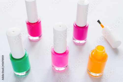 multi-colored nail polish on a white background
