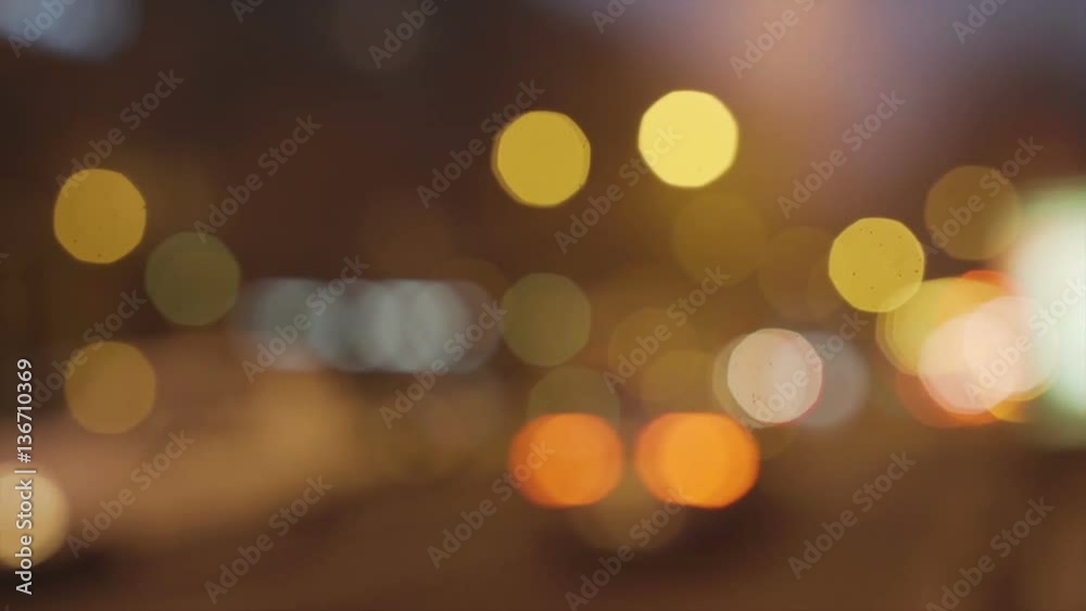 Road traffic in city at night. Shot is made with defocus. Road traffic in city at night. Shot is made with defocus.