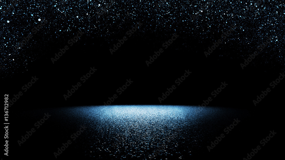Fototapeta brokatowe tło - migoczący niebieski brokat spadający na płaską powierzchnię oświetloną jasnym reflektorem