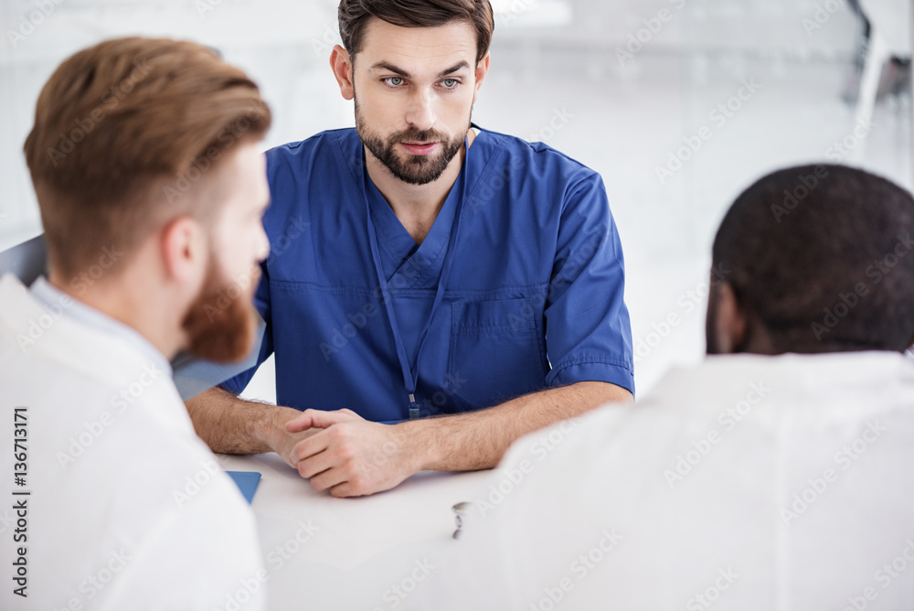 Serene physician telling with affiliates at conference Serene physician telling with affiliates at conference