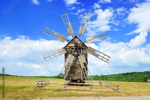 Old wooden windmill against the sky.