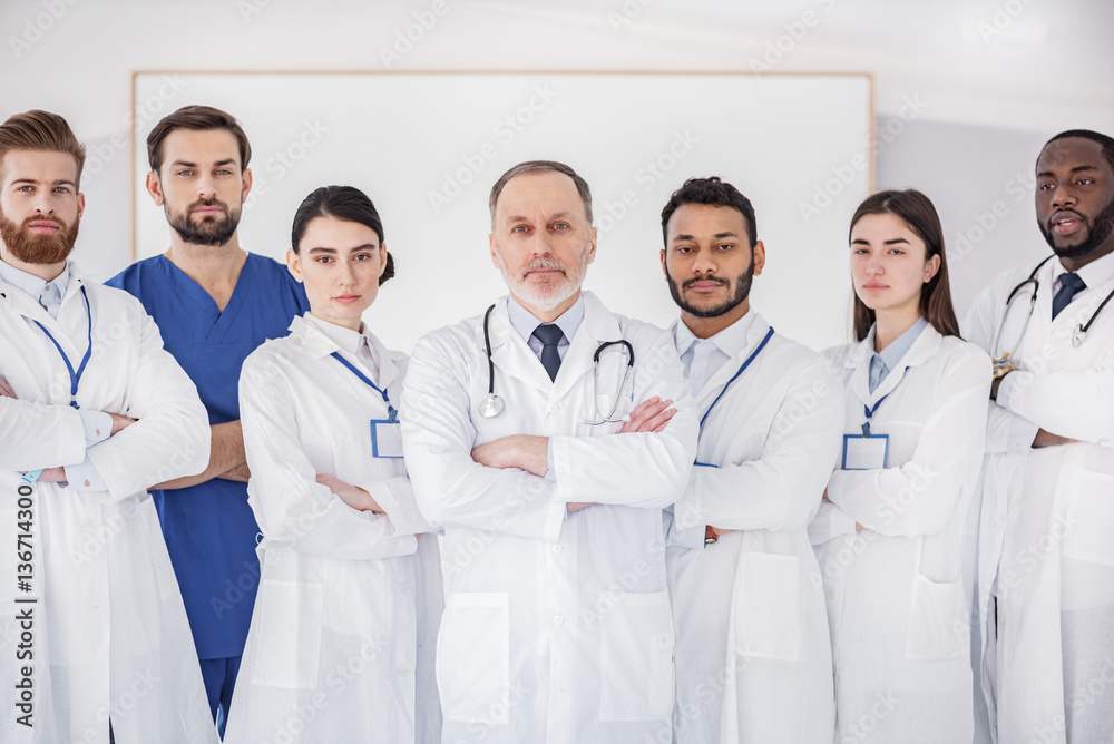 Sure team of physicians standing at conference Sure team of physicians standing at conference