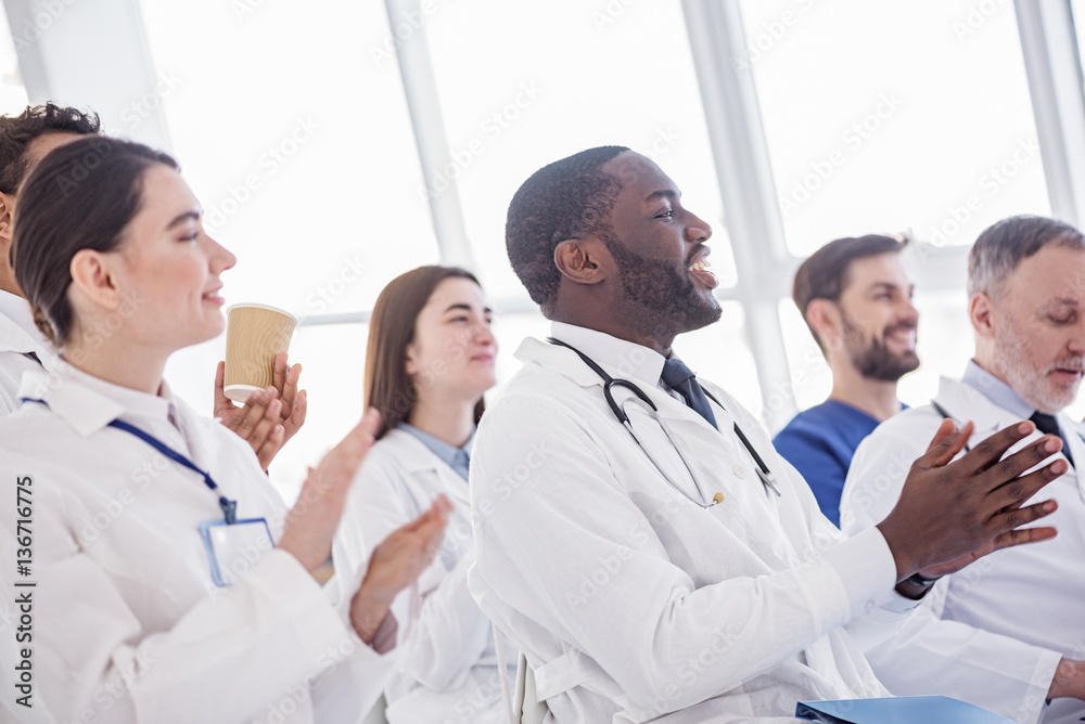 Happy therapeutics clapping hands during meeting Happy therapeutics clapping hands during meeting