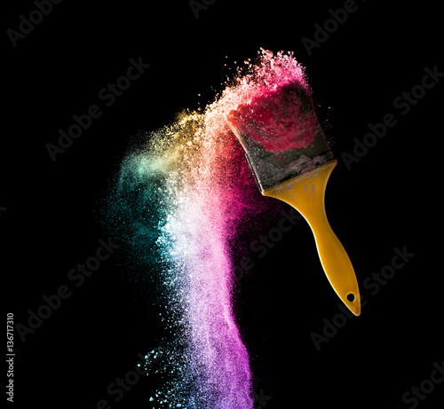 paint brushes with abstract powder color explosion isolated on b photo