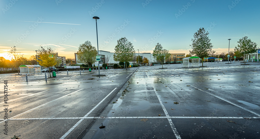 Outdoor empty car park at sunrise