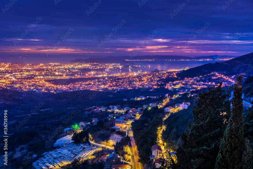 Obraz premium Split cityscape night aerial view. / Night scenic view at cityscape of town Split and suburb from upper hills in background, Croatia, european travel places.