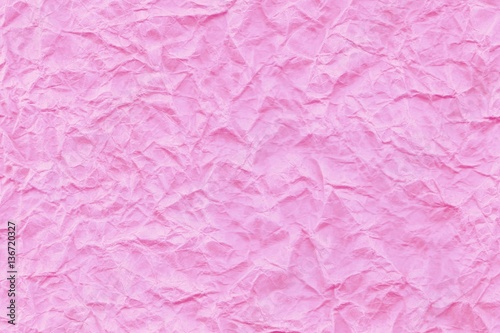 Background of pink abstract wrinkled kraft paper