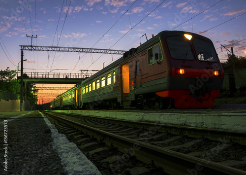 The train at sunset costs at the station