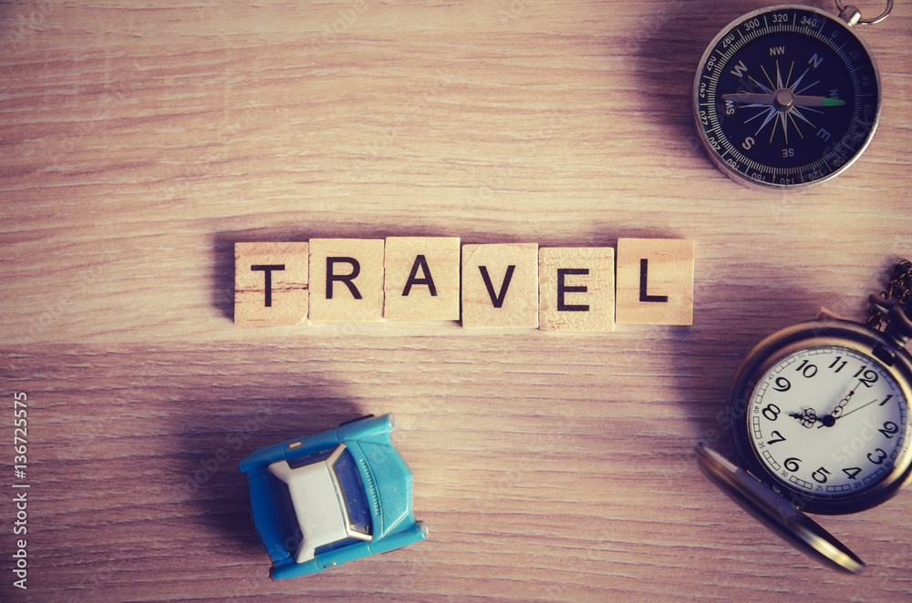 travel concept . travel word on wooden cube block on wood backgr travel concept . travel word on wooden cube block on wood backgr