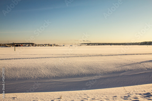 snow-covered field, clear winter day