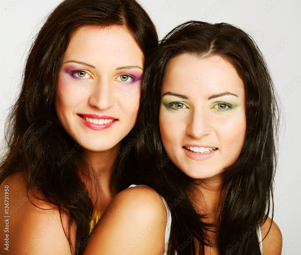 Two girl friends together smiling Two girl friends together smiling