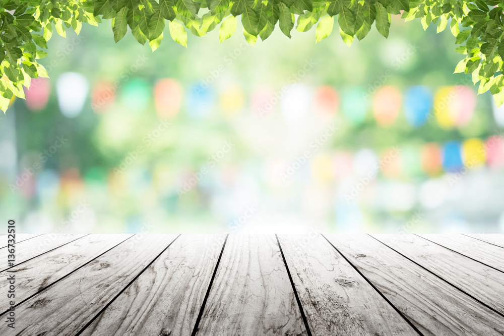 Empty wooden table with party in garden background blurred. Empty wooden table with party in garden background blurred.