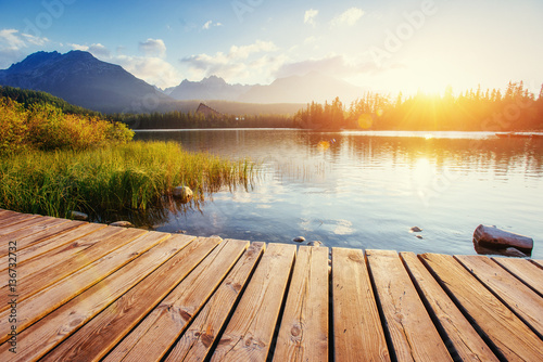 The sunrise over a lake in the park High Tatras.