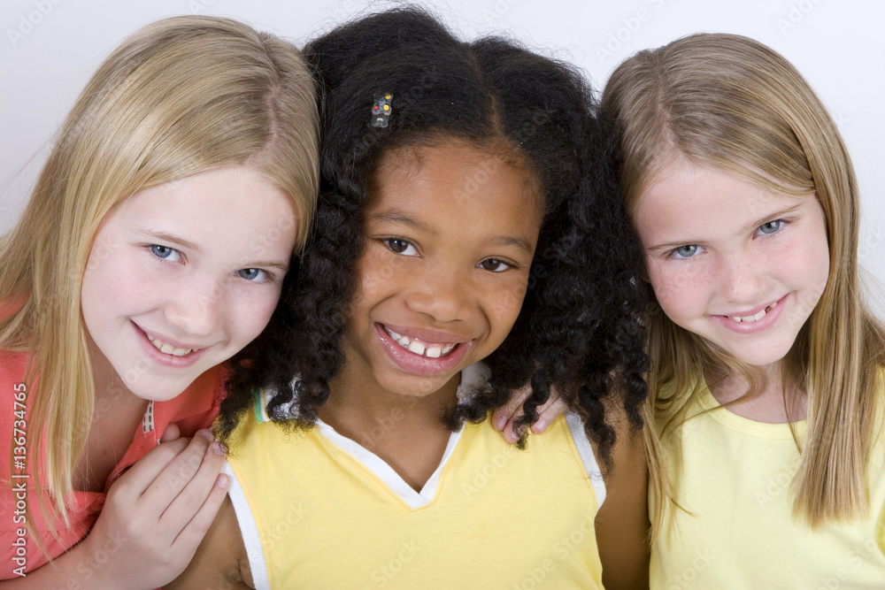 Happy diverse group of little girls.