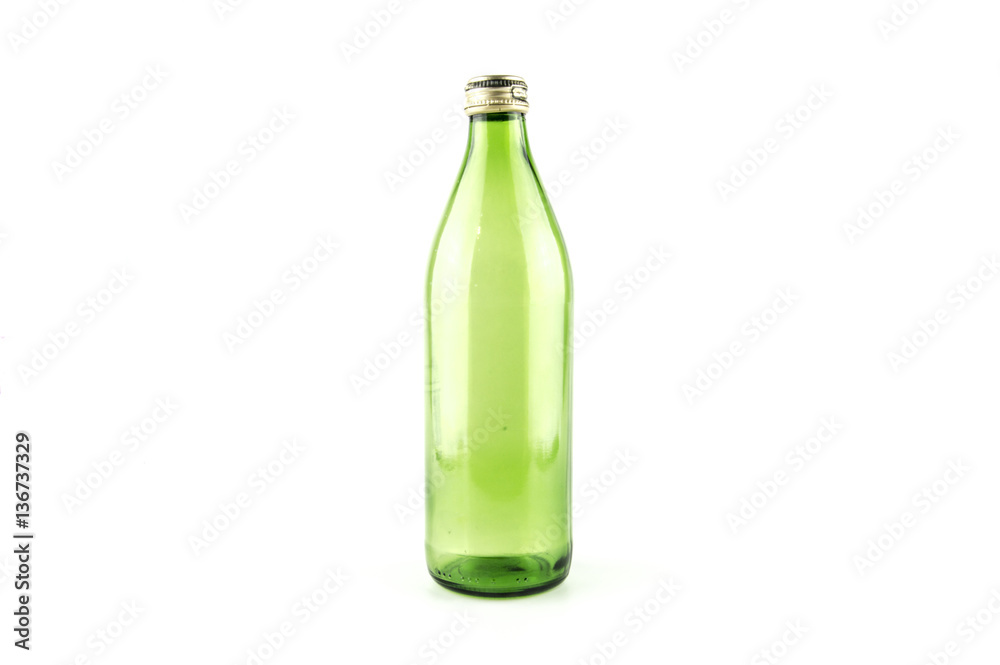 Glass empty green bottle isolated on a white background Glass empty green bottle isolated on a white background