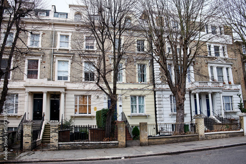 LONDON CITY - DECEMBER 25, 2016: Residential housing with typical entrances with stairs on Cambridge Gardens in Notting Hill