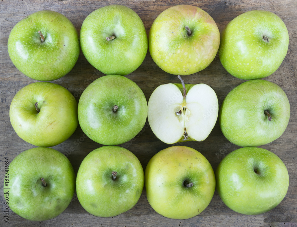 Large group of healthy, green apples on wooden table Large group of healthy, green apples on wooden table