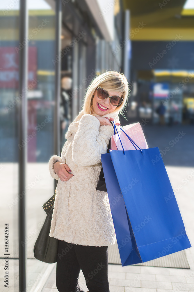Middle age woman walking and enjoy in shopping .Colored photo Middle age woman walking and enjoy in shopping .Colored photo