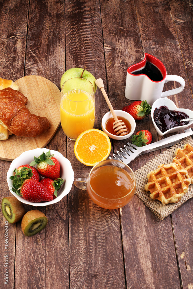 breakfast in bed with fruits and pastries on a tray -waffles, cr breakfast in bed with fruits and pastries on a tray -waffles, cr