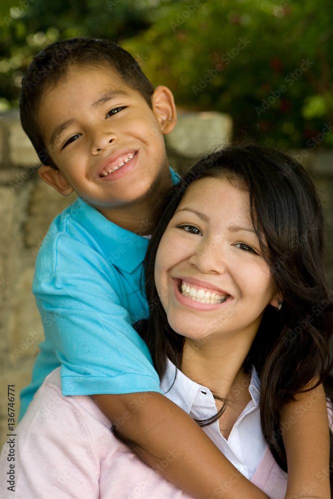 Happy Hispanic mother and her son. Happy Hispanic mother and her son.