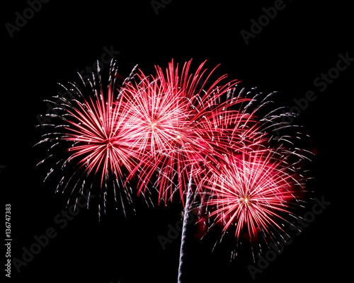 White and red fireworks on black background at international com