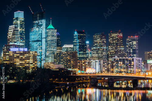 The Philadelphia skyline and Schuylkill River at night, in Phila