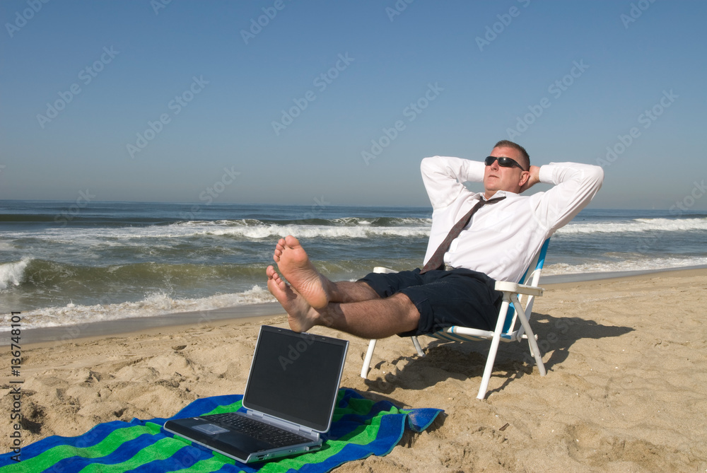 Businessman on beach relaxing