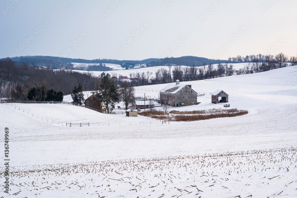View of a snow covered farm and rolling hills, near Shrewsbury,