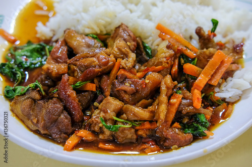 Rice topped with stir-fried pork and basil.